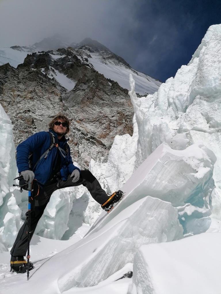 Posing while crossing a glacier