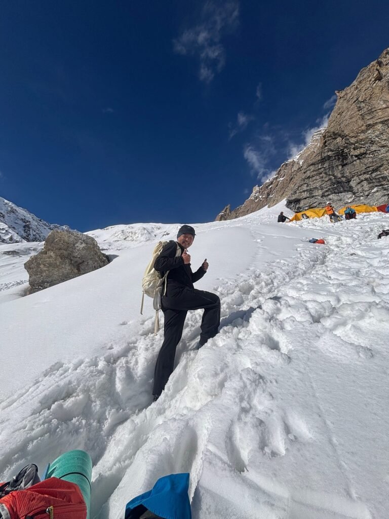 Climber on a broad peak