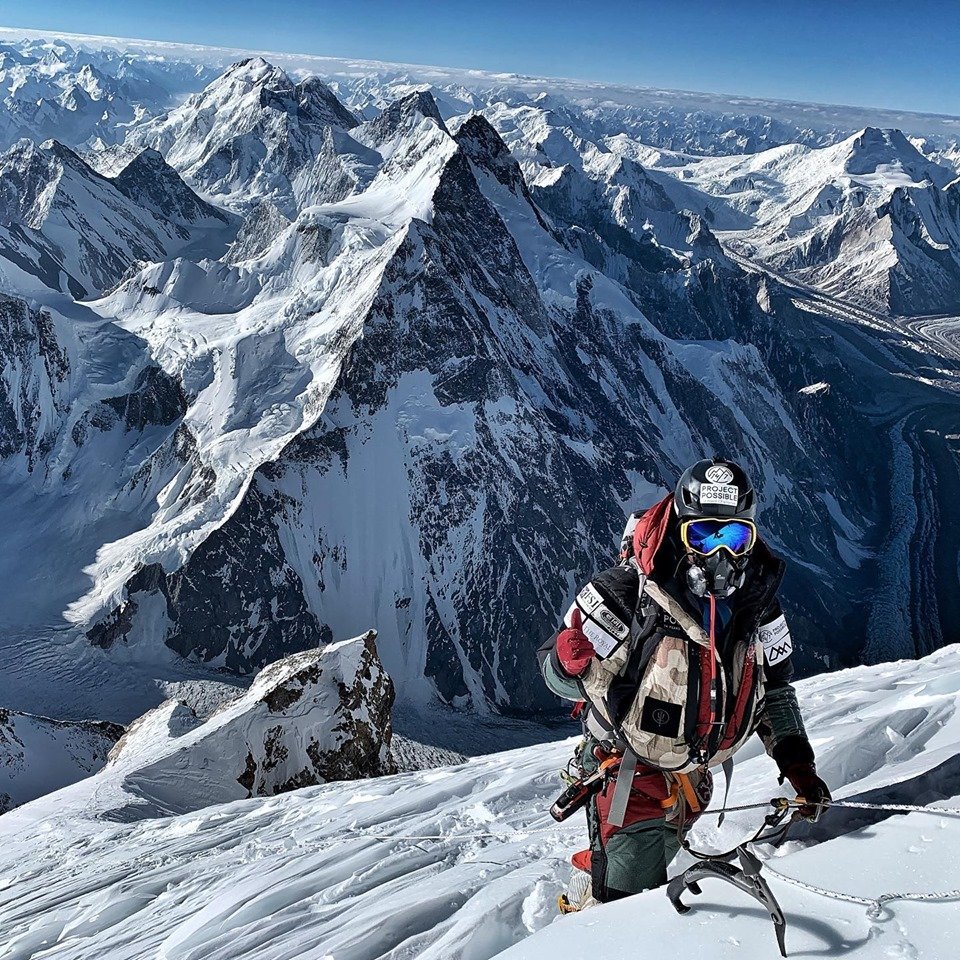 The beautiful Karakoram Range behind the climber