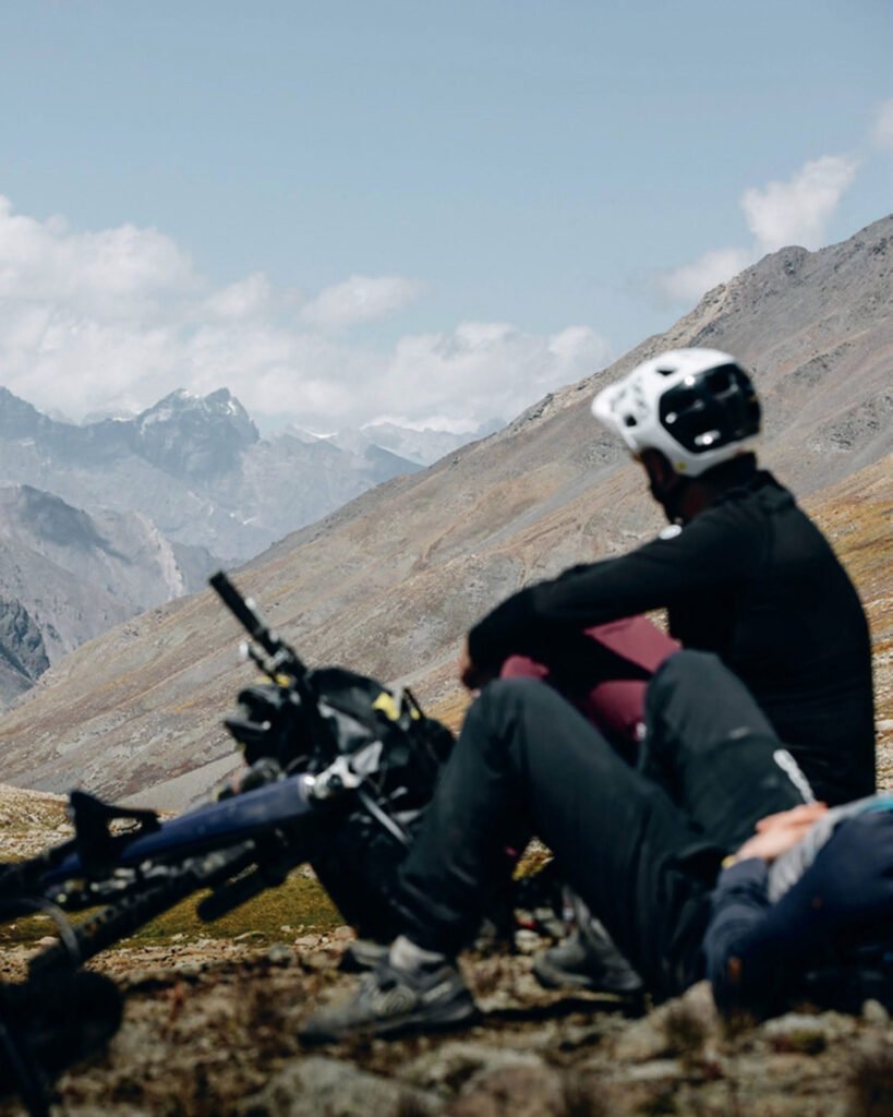 Biker relaxing with mountain views