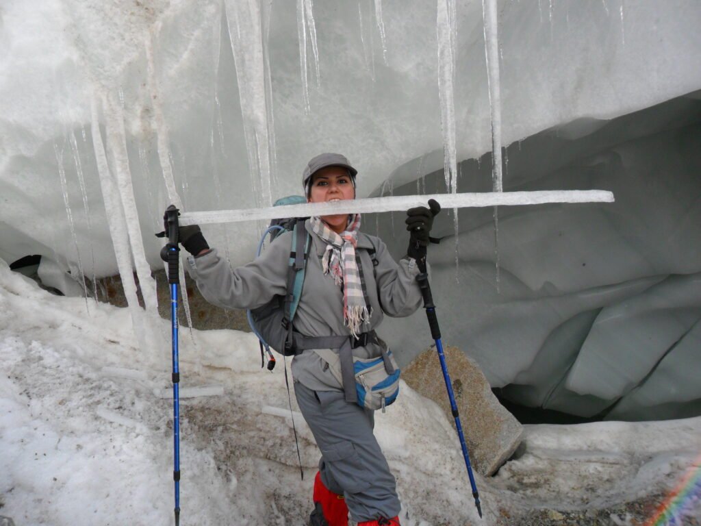 A lady trekker tries to enjoy the ice